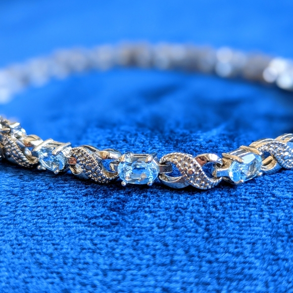 Blue Topaz and Diamond Accent Infinity Bracelet - Picture 7 of 9